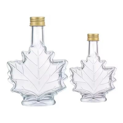 Bouteille de boissons en verre industriel de couleur personnalisée en forme de feuille d'érable 50 ml 100 ml 250 ml