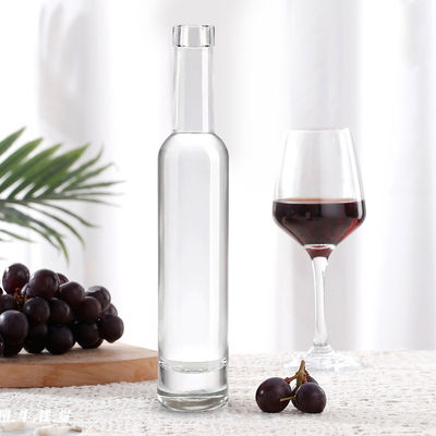 Bouteille de verre ronde de 200 ml 375 ml 500 ml 750 ml 1000 ml avec couvercle en liège et conception personnalisée