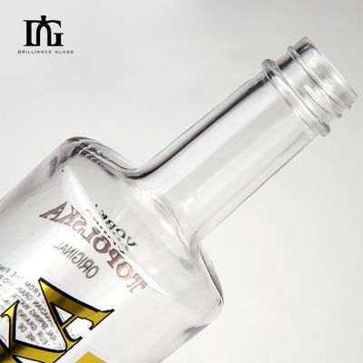 Bouteille ronde transparente d'alcool avec étiquette à chaud et bouchon de liège Capacité 750 ml