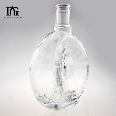 Bouteille en verre à surface lisse irrégulière ronde sur mesure pour la production de whisky gin de 700 ml