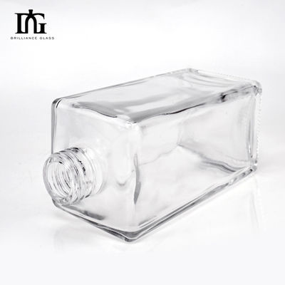 Bouteille de verre vierge transparente de 700 ml de forme ronde personnalisée pour le whisky Vodka Tequila
