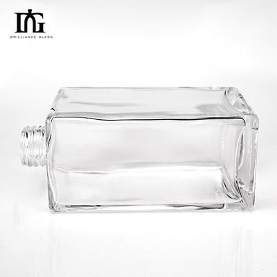 Bouteille de verre vierge transparente de 700 ml de forme ronde personnalisée pour le whisky Vodka Tequila