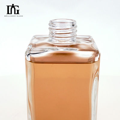 Bouteille de verre vierge transparente de 700 ml de forme ronde personnalisée pour le whisky Vodka Tequila